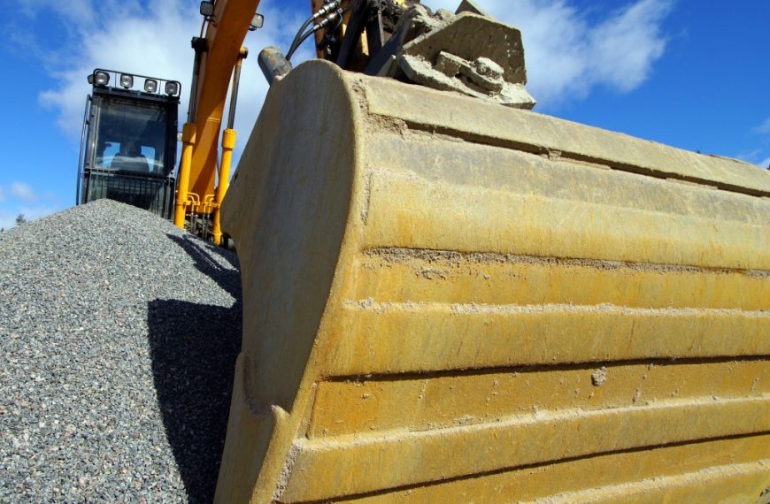 An excavator being operated on a sunny day