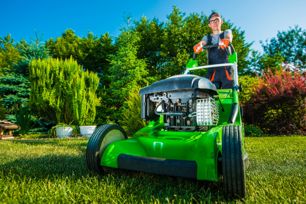 professional lawn mower with his machine