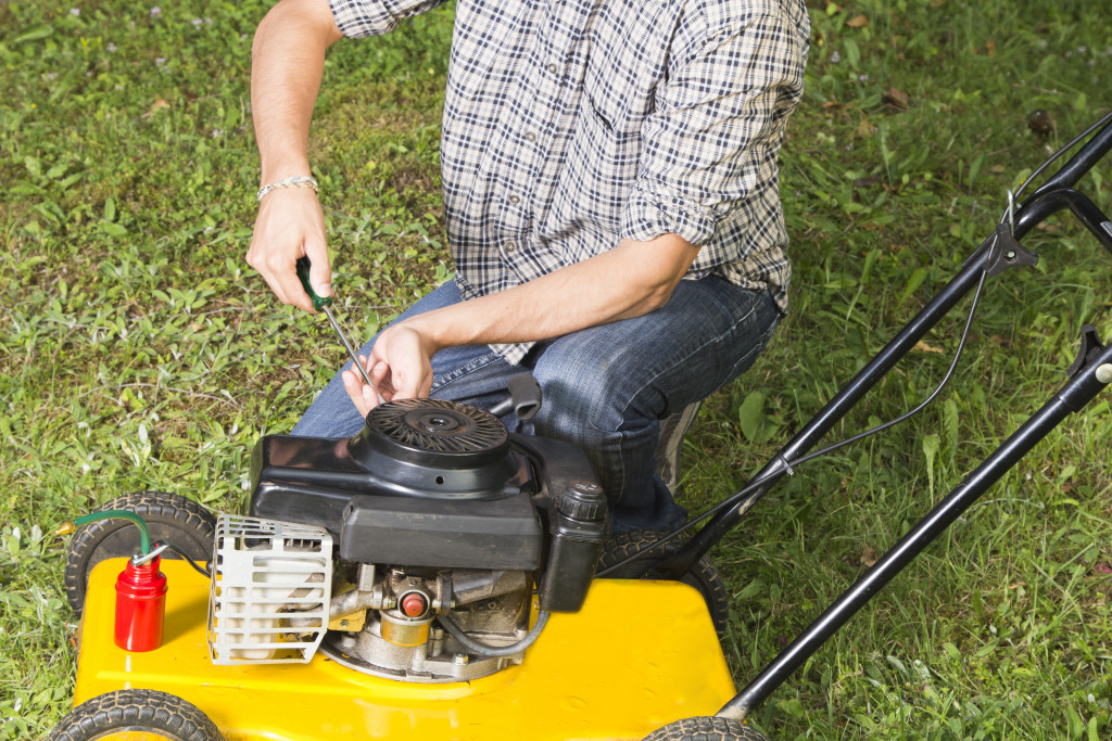 lawn mowing machine operated by a man 