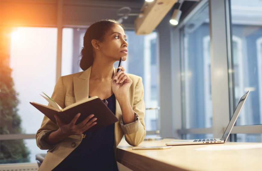 woman holding her notebook