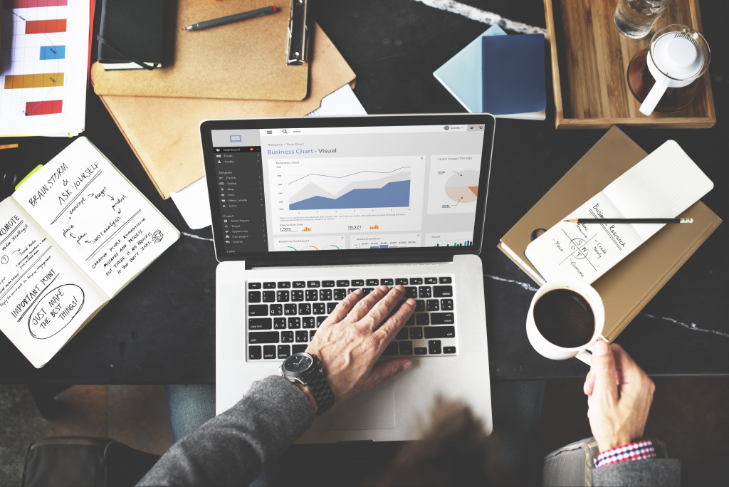 businessman with coffee checking data