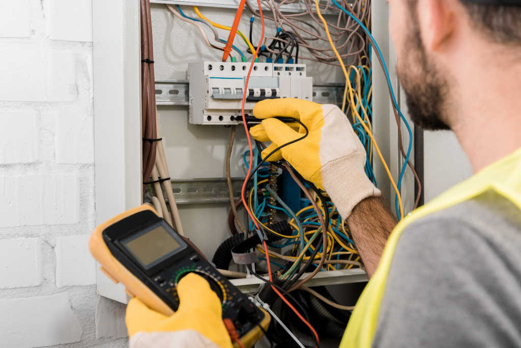 a contractor inspecting the electrical grid